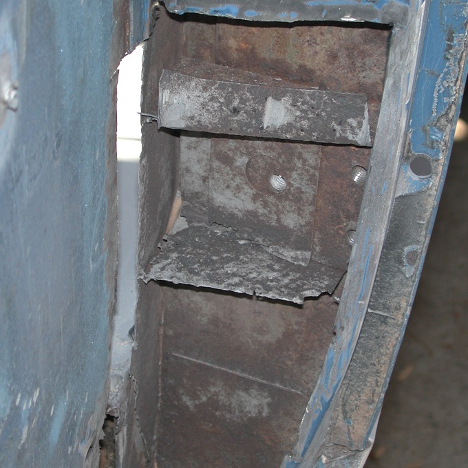 rusted metal frame section with bolts
