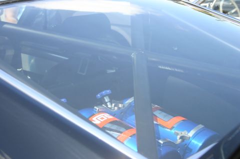 1968 Shelby GT500 - Car interior with NOS bottles and roll cage visible through the window.