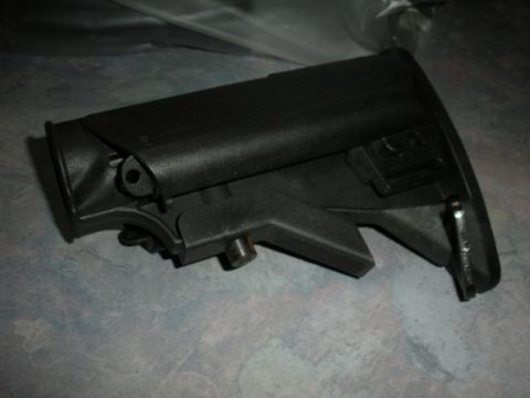 1996 Ford Bronco - A black rifle stock is shown against a textured background, with a Supermotors.net watermark in the lower right corner.