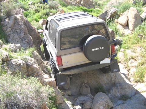 1990 Ford Bronco II - This 1990 Ford Bronco II tackles a challenging rocky path, demonstrating its off-road capabilities.