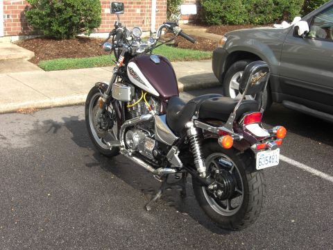 1986 Honda Shadow Aero - Rear view of a 1986 Honda Shadow Aero motorcycle in maroon and white, parked next to an SUV.