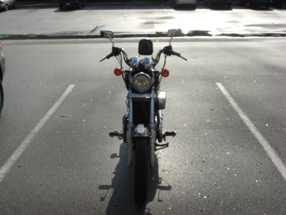1986 Honda Shadow Aero motorcycle parked front view. Chrome handlebars, round headlight, orange turn signals