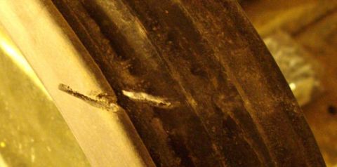 1979 Ford Bronco - Close-up of a damaged metal component, visible text from Supermotors.net.