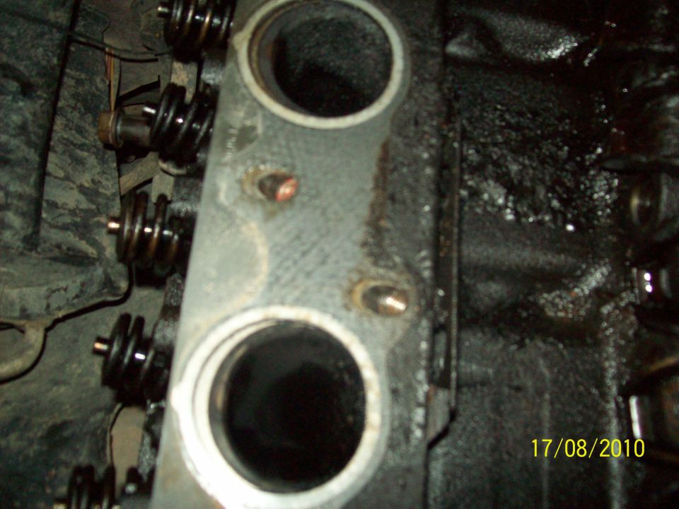 Engine cylinder head with valve springs and visible date stamp