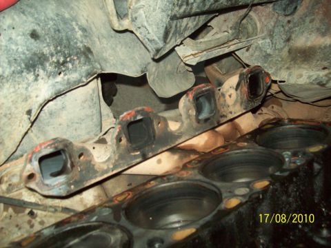 1985 Ford Bronco - Close-up view of an engine block and exhaust manifold, with a date stamp indicating it was photographed in 2010.