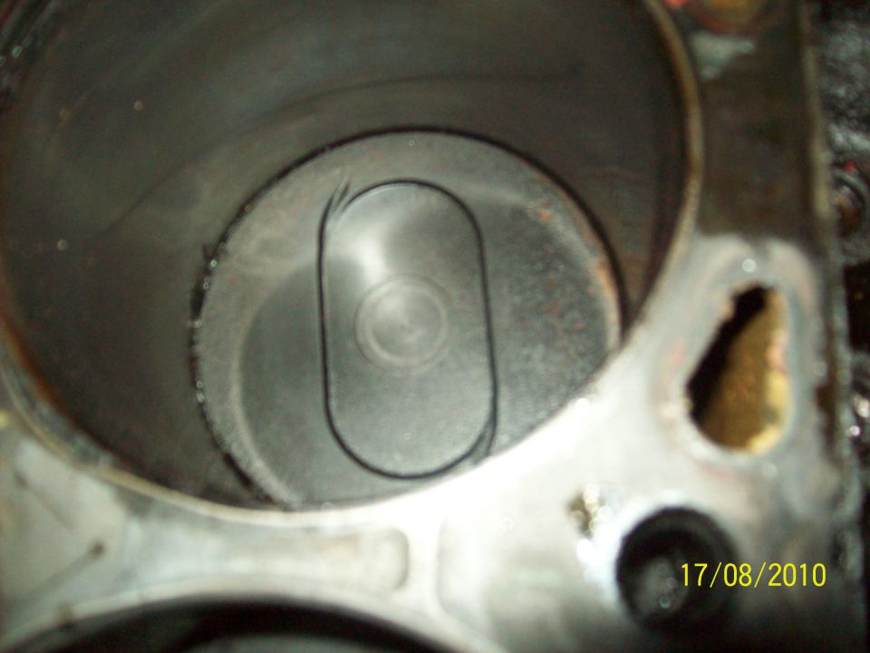 Engine cylinder with piston visible, timestamp 17/08/2010