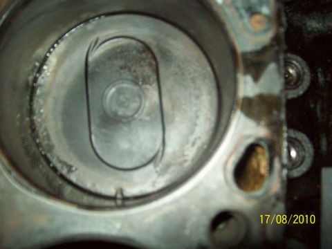 1985 Ford Bronco - Engine cylinder shows signs of wear and tear, with carbon deposits visible.