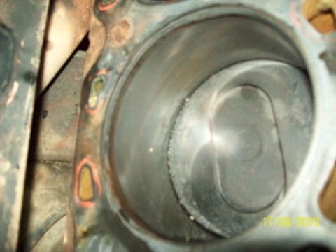 1985 Ford Bronco - This is a close-up view of a single engine cylinder, showing signs of wear and tear.