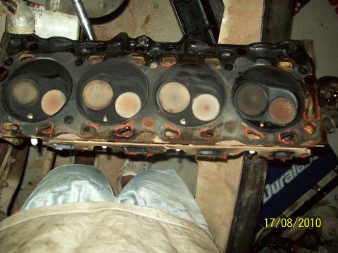 1985 Ford Bronco - Close-up of an engine cylinder head, likely removed for repair or inspection.