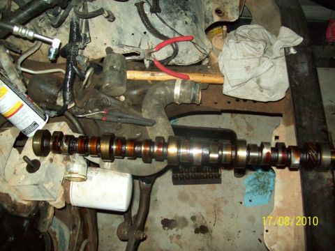 1985 Ford Bronco - Engine camshaft and associated parts are laid out for inspection or repair.