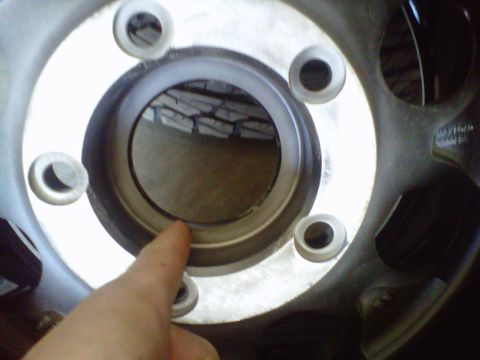 1994 Ford F-150 - Close-up view of a wheel hub, showing lug nut mounting points and the central bore.