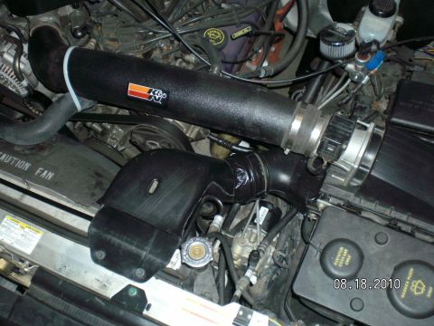 1996 Ford Bronco - Close-up of an engine bay, focusing on a K&N air intake system and various engine components.