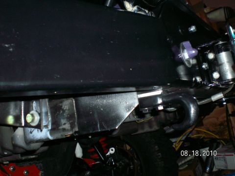 1996 Ford Bronco - Close view of a vehicle's undercarriage, showing the frame and a tow hitch assembly.