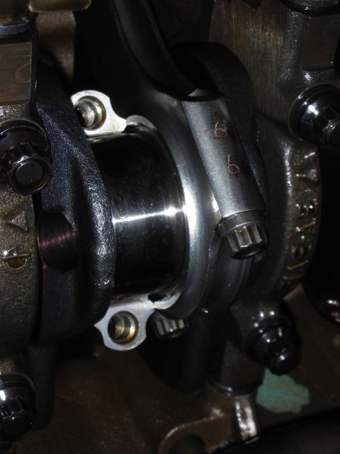 1992 Ford Crown Victoria - Engine connecting rod with stamped numbers, likely part of a rebuild or modification.