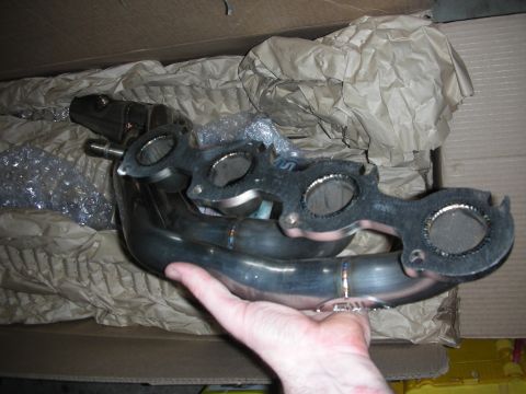 1992 Ford Crown Victoria - New exhaust manifold part, likely for an engine rebuild project.