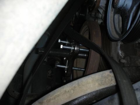 2004 Ford Crown Victoria - Close-up view of the engine's pulley system, showing a Steeda Underdrive pulley installation.