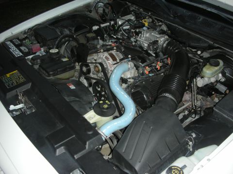 2004 Ford Crown Victoria - Engine bay detail a blue hose and Interstate battery, not a 2004 Ford Crown Victoria.