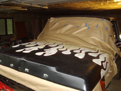 1978 Ford Bronco - Hood of a 1978 Ford Bronco with flame decals, masked for painting.