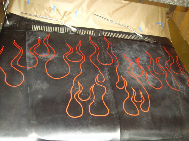 Black hood with orange flame decals and two windshield wipers