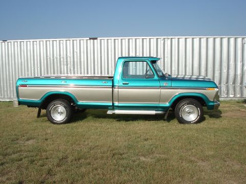 1979 Ford F-150 - This 1979 Ford F-150 pickup truck features a distinctive teal and silver two-tone paint scheme.
