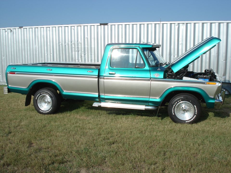 1979 Ford F-150 pickup truck, two-tone teal and silver, hood open