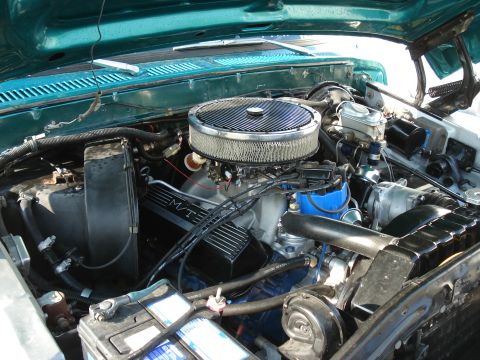 1979 Ford F-150 - Close-up view of a V8 engine, showing the air filter, carburetor, and other engine components.