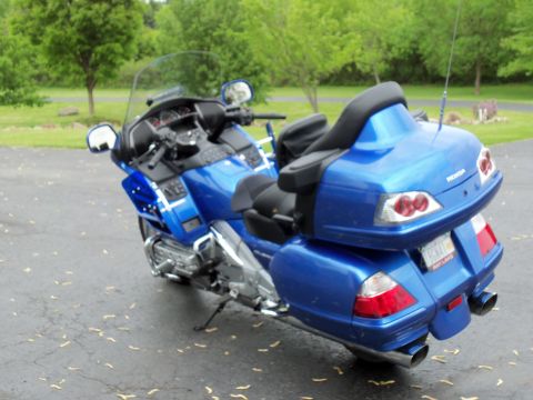 2009 Honda GoldWing - Rear view of a blue 2009 Honda GoldWing motorcycle parked outdoors.
