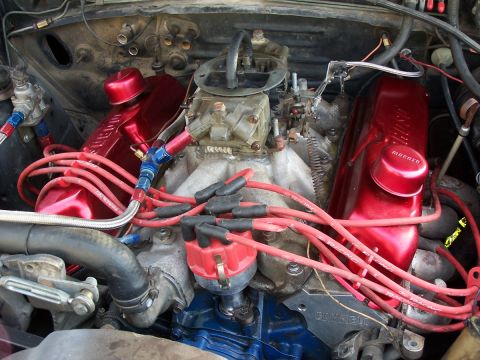 1979 Ford F-150 - The engine bay features a carburetor, distributor, and custom red valve covers.