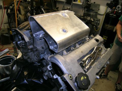 1995 Ford Probe - Engine components are visible in a workshop setting with various tools and equipment.