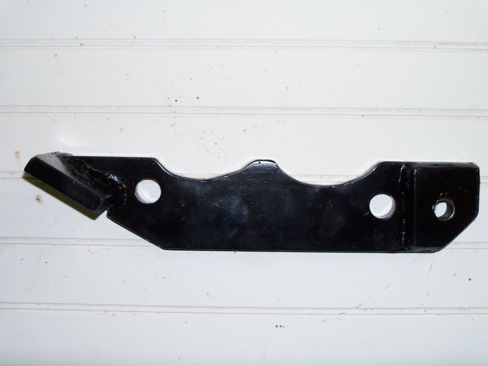 Black painted metal bracket with three holes on white beadboard background