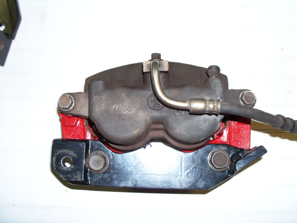 Crown Vic caliper assembly: caliper, caliper bracket and fabricated spindle bracket.
