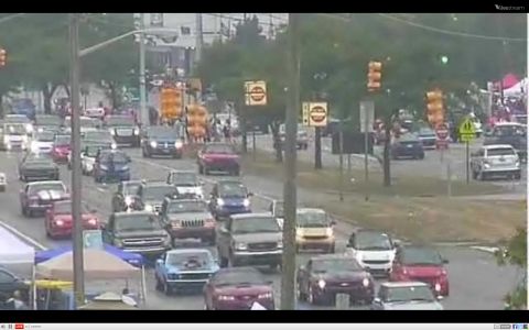 1971 Ford Ranchero - A busy street scene shows a traffic jam with many vehicles, including trucks and cars.