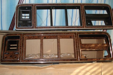 1979 Ford F-150 - Two dashboard trim pieces with wood-grain finish are shown, likely for an older vehicle.