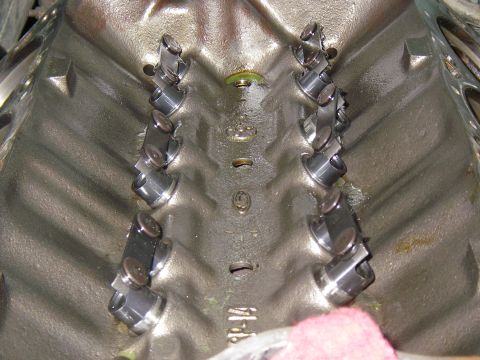 1990 Ford Bronco - Overhead view down into the lifter valley of a disassembled V8 engine block with the intake manifold removed, showing two banks of eight hy…