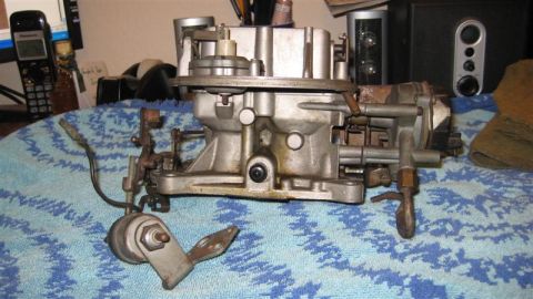 1968 Ford Ranchero - This carburetor is shown on a patterned cloth, with a phone and computer monitor in the background.