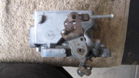 1968 Ford Ranchero - Close-up view of a carburetor, showing its mechanical components and some visible markings.