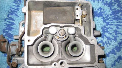 1968 Ford Ranchero - Internal view of a carburetor, revealing its complex mechanical structure and dual intake ports.