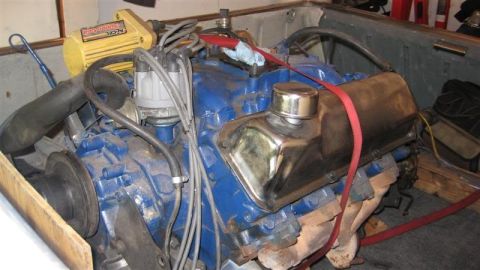 1968 Ford Ranchero - Close-up of a V8 engine, likely out of a vehicle, with various hoses and wiring visible.