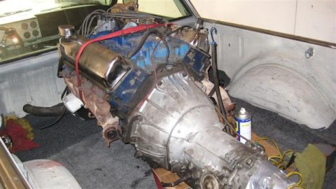 1968 Ford Ranchero - Engine and transmission assembly is secured in the bed of a vehicle, ready for transport or installation.