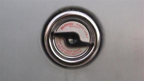 1968 Ford Ranchero - Fuel filler cap warning label reads: 'WARNING! REMOVE SLOWLY. FUEL SPRAY MAY CAUSE INJURY UNDER PRESSURE.'