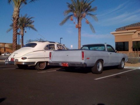 1968 Ford Ranchero - A light blue 1968 Ford Ranchero is parked in a lot next to a vintage sedan.