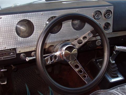1968 Ford Ranchero - The interior features a custom dashboard with multiple gauges and an aftermarket steering wheel.
