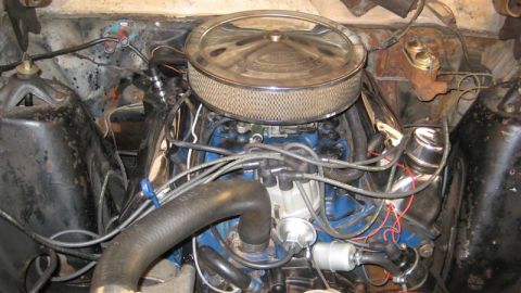 1968 Ford Ranchero - Engine bay of a 1968 Ford Ranchero, a chrome air cleaner and blue painted engine block.