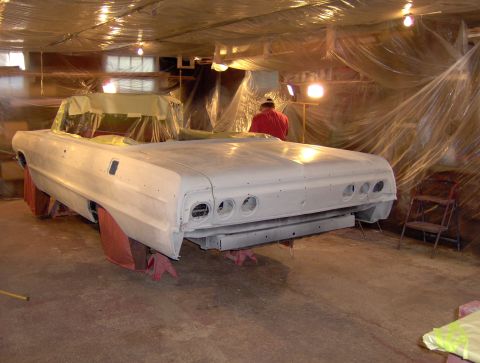 1964 Chevrolet Impala - A 1964 Chevrolet Impala convertible is prepped for paint in a workshop.
