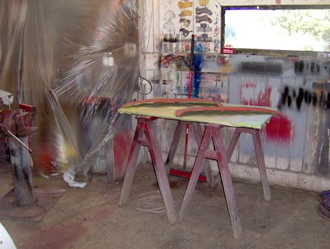 1964 Chevrolet Impala - Car trim pieces are prepped for painting on sawhorses in a workshop setting.