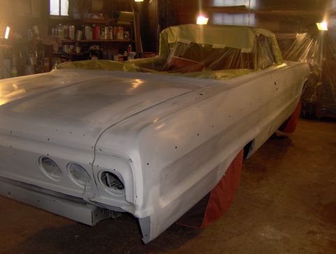 1964 Chevrolet Impala - Rear view of a 1964 Chevrolet Impala convertible body undergoing paint preparation.