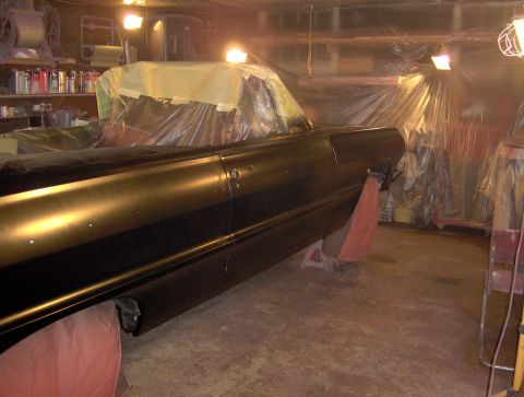 1964 Chevrolet Impala - Car body undergoing a paint job in a garage, covered with plastic sheeting.