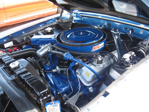 1968 Shelby GT500 - The engine bay of a 1968 Shelby GT500, a blue Ford Cobra Jet air cleaner and 428 valve covers.