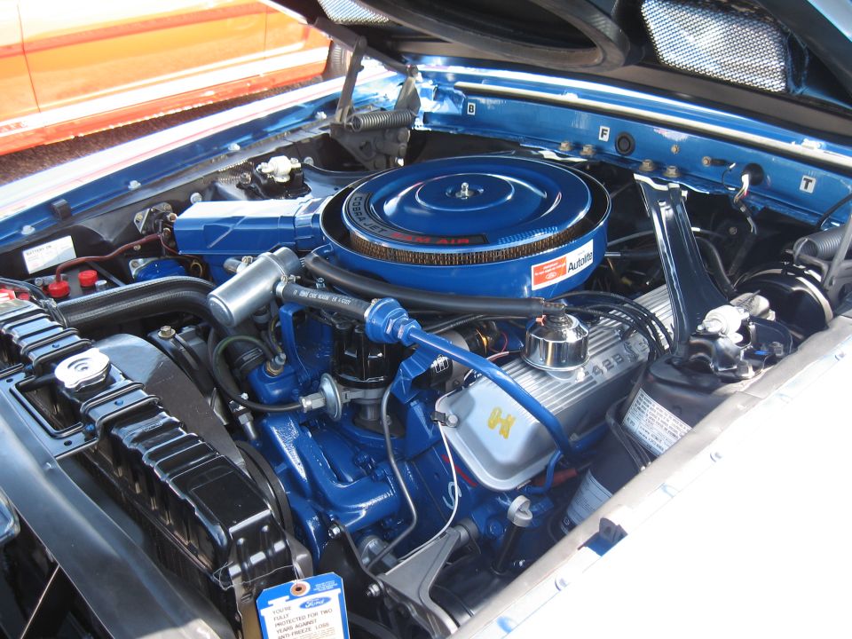 1968 Shelby GT500 engine bay with blue Ford Cobra Jet air cleaner and 428 valve covers