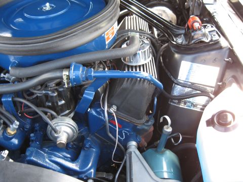 1968 Shelby GT500 - Close-up view of the engine bay in a 1968 Shelby GT500, highlighting the blue painted engine block and air intake system.